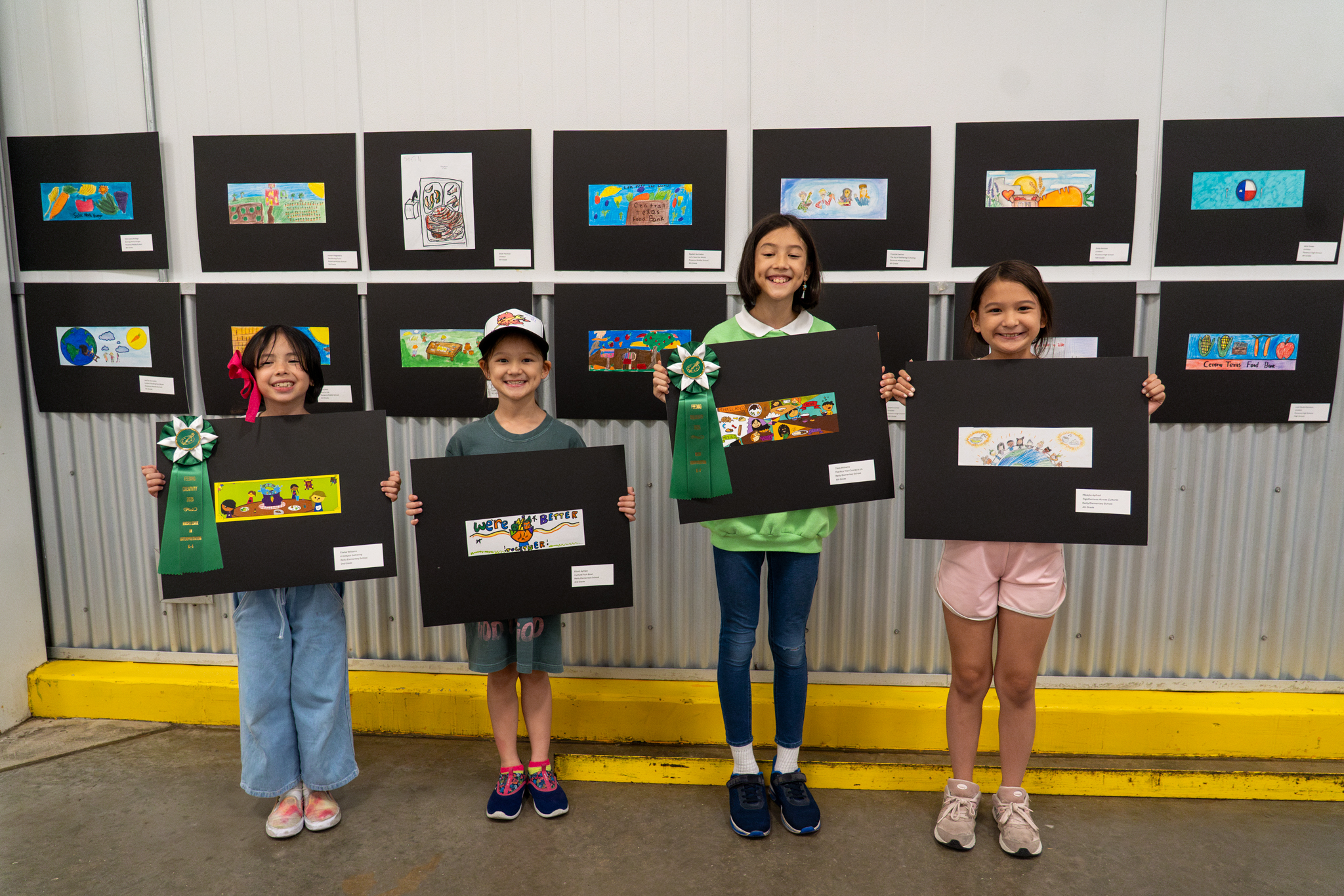 Children Showing Off Their Artwork