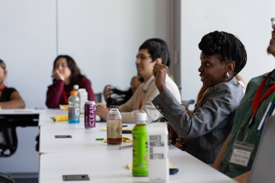 CTFB workforce training students at Indeed offices watching presentation.