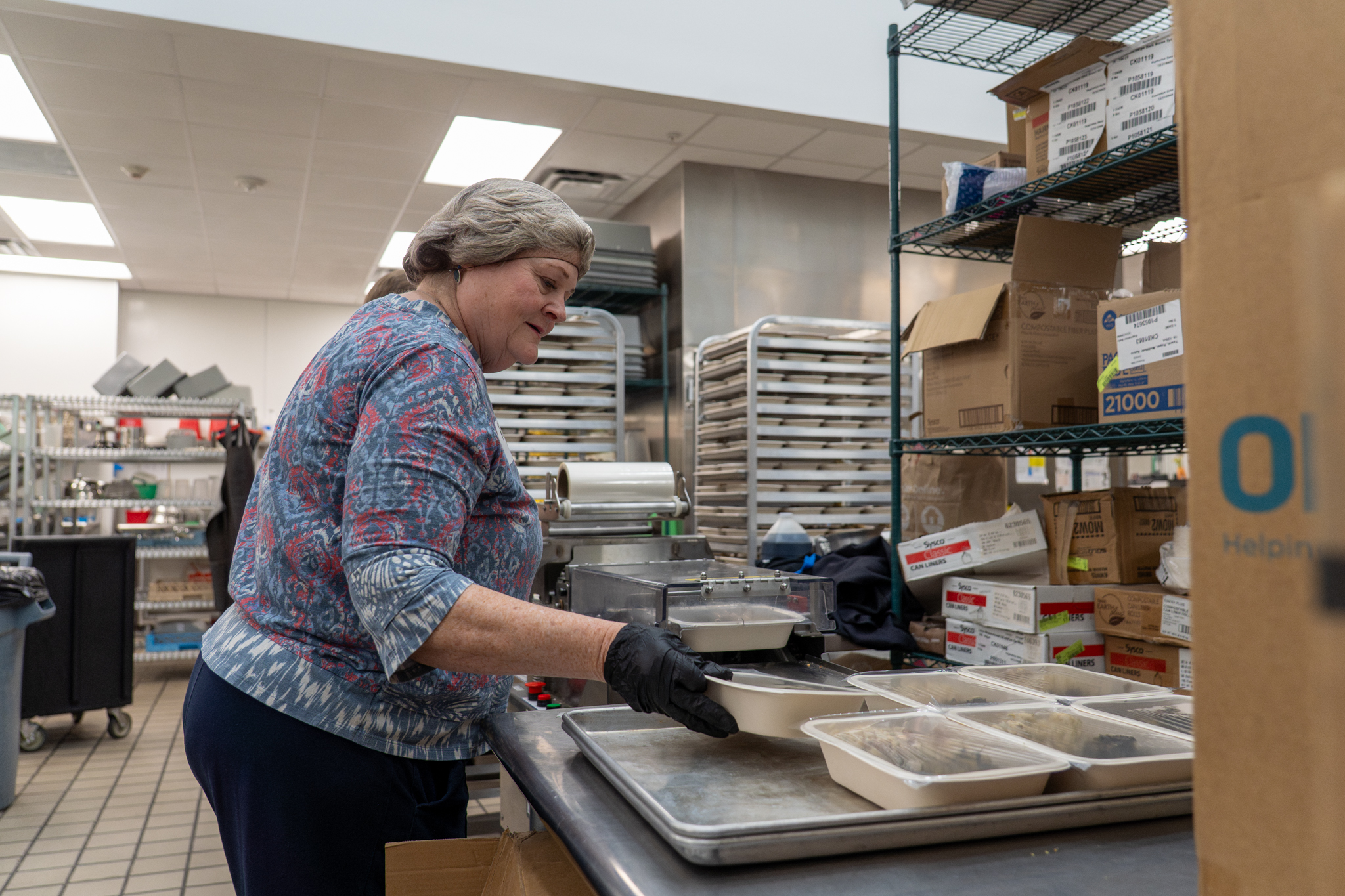 Volunteer Tracy working in the kitchen.