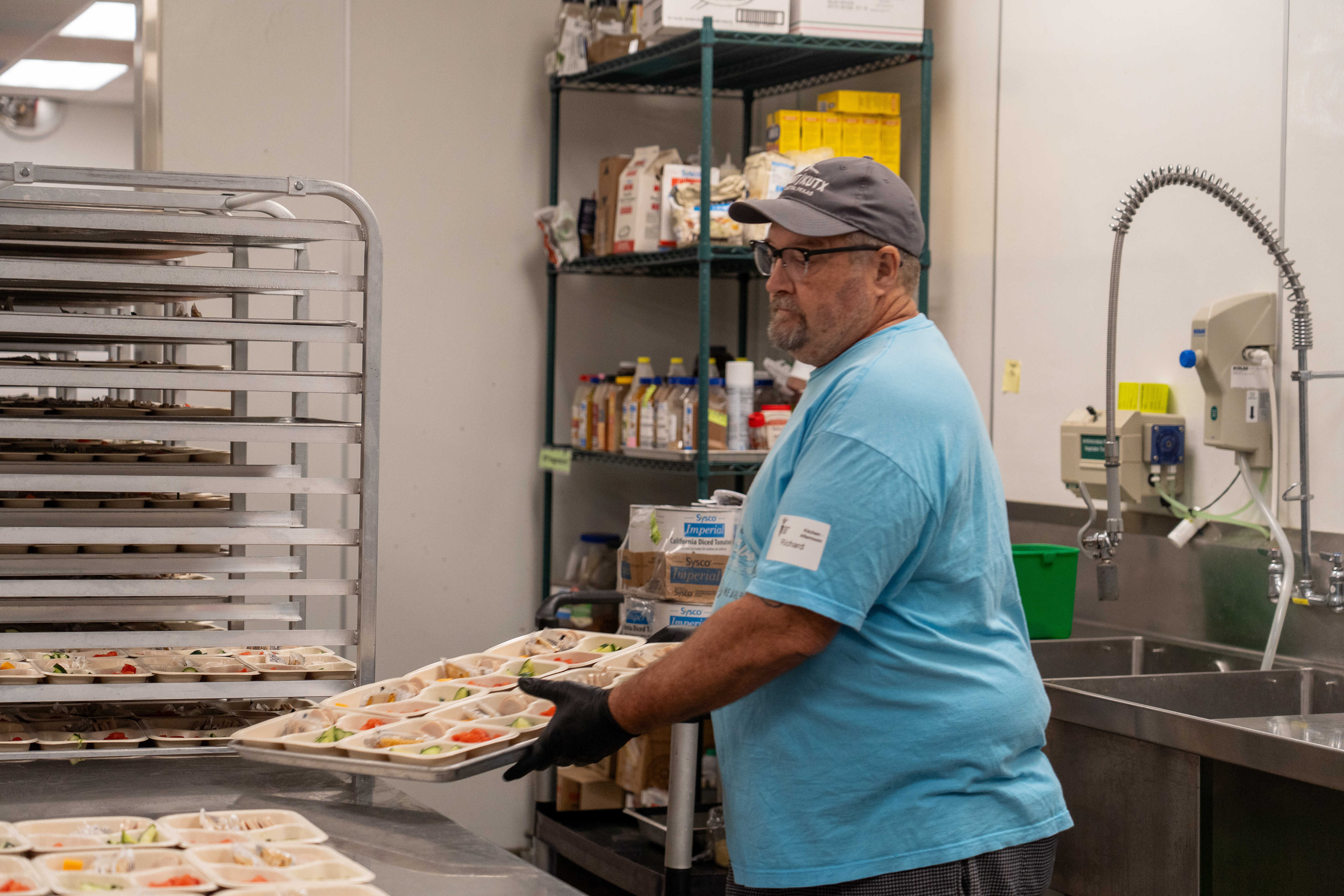Retired educators prepare free summer meals for kids in the Central Texas Food Bank kitchen.