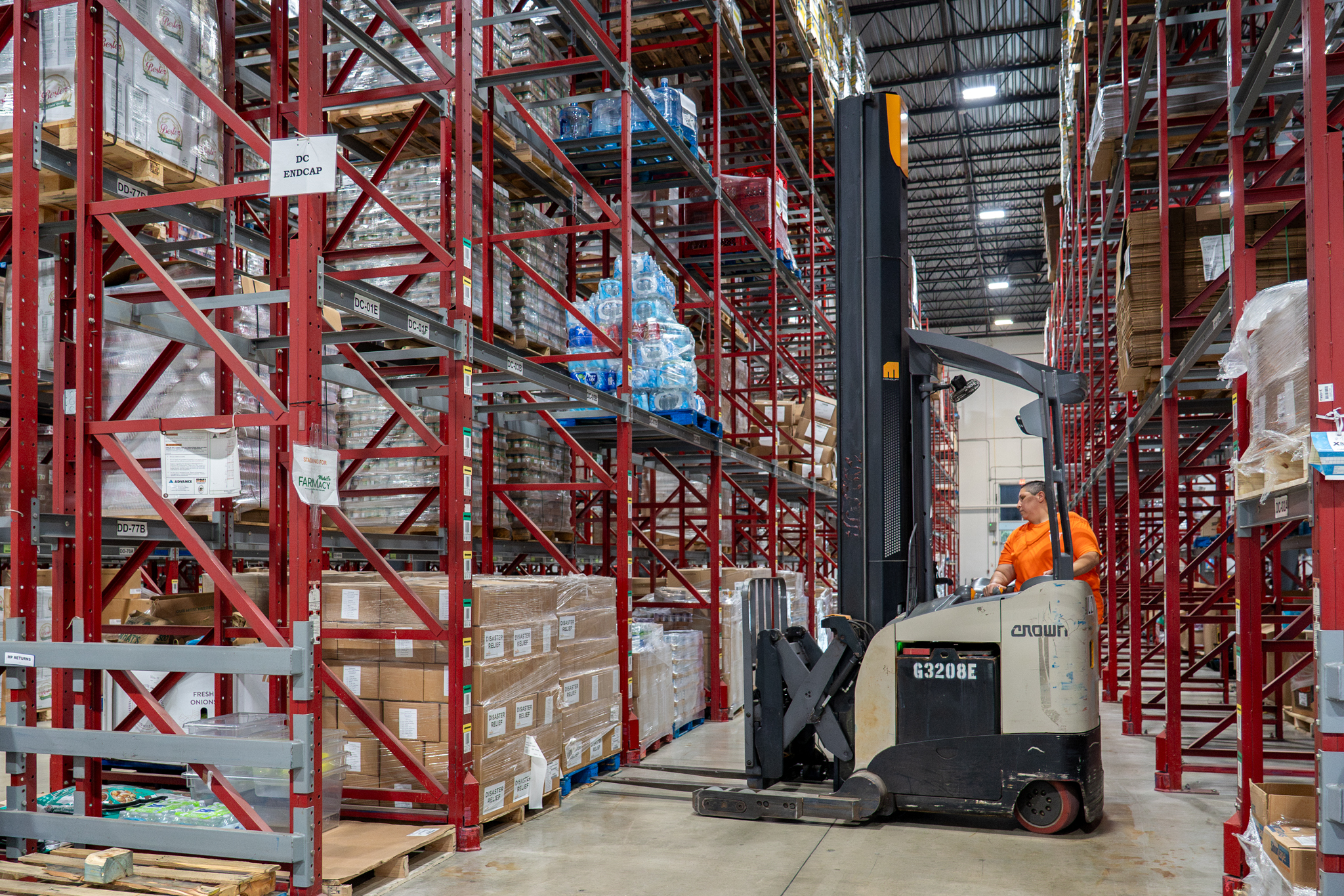 Cindy Maneuvering a Forklift in CTFB's Warehouse